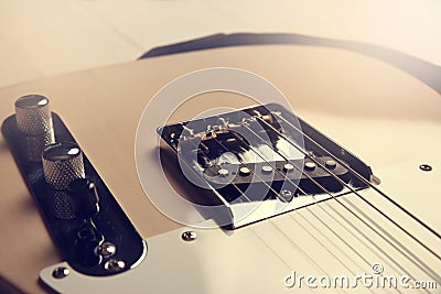 Acoustic guitar with black strap Stock Photo