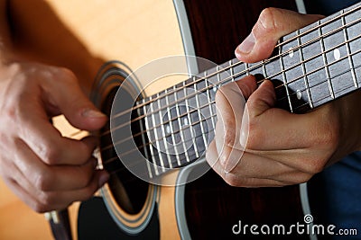 Acoustic guitar player performing song Stock Photo