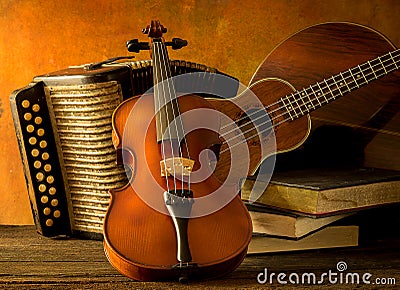 Acoustic musical instruments guitar ukulele violin Stock Photo