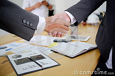 acquisition business people shaking hands, finishing up a meeting. Stock Photo