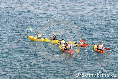 Acre, Israel - 11.05.2018: Sports outdoor active rest. Young people paddling on tandem sea kayak. Active summer vacation on the Editorial Stock Photo
