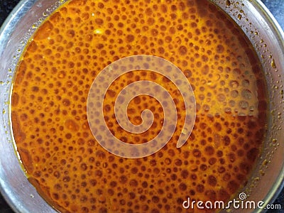 Acrid rassa with oil pours in round bowl Stock Photo