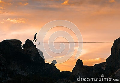 An acrobat walking the slackline Stock Photo