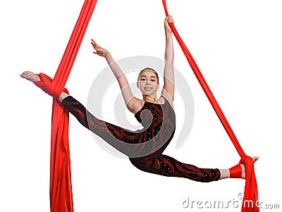 Acrobatic gymnastic girl exercising on fabric rope Stock Photo
