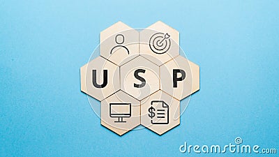 Acronym USP or Unique Selling Proposition. Abstract icons and text on wooden forms Stock Photo