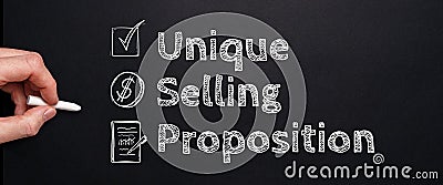 Acronym USP or Unique Selling Proposition. Person drawing with chalk on a blackboard Stock Photo