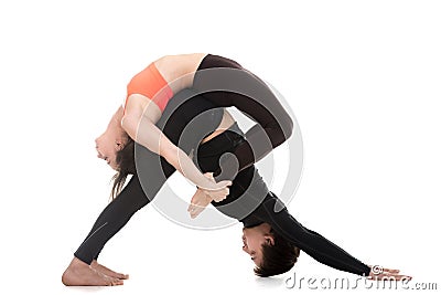 Acroyoga, downward-facing dog and bow pose Stock Photo