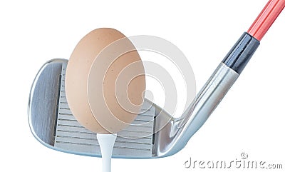 Action hen egg in front of golf club on white background, health Stock Photo