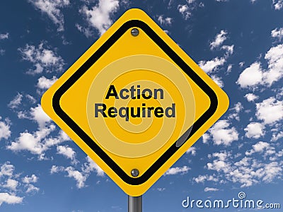 action required traffic sign on blue sky Stock Photo