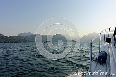 Action shot from the point of view of a person viewing from inside a boat, as it moves across the ocean with beautiful islands Stock Photo