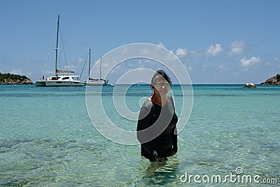 Active Senior Woman Standing in Tropical Bay Stock Photo