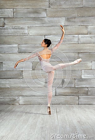 Active ballerina performing attitude pose Stock Photo