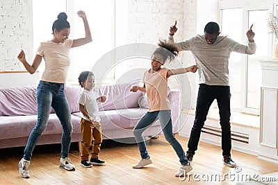 Active black family with children dancing at home Stock Photo