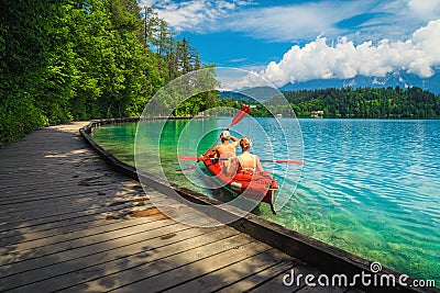 Active couple canoeing and enjoying the view, lake Bled, Slovenia Editorial Stock Photo