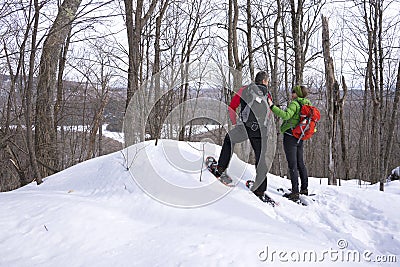 Active Couple on Snowshoes Editorial Stock Photo
