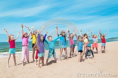 Active happy children on the beach Stock Photo