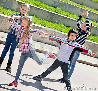 Active kids moving during acting game Stock Photo