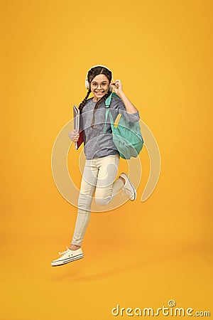 Active learning. Active girl run to school. Happy kid back to school. Active childhood. School time. September 1. Childs Stock Photo