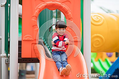 Active little girl on playground Stock Photo