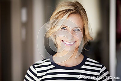 Active Mature Woman Smiling At The Camera Stock Photo