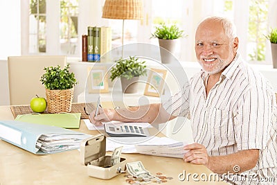 Active pensioner working at home Stock Photo