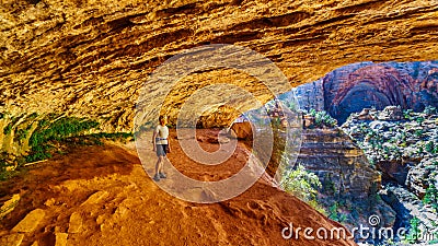 Active Senior woman in a cave on a hike on the Canyon Overlook Trail in Zion National Park, Utah Editorial Stock Photo