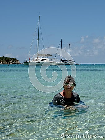 Active Senior Woman Swimming in Tropical Bay Stock Photo