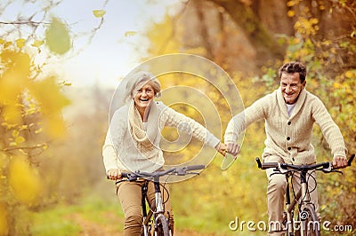 Active seniors riding bike Stock Photo