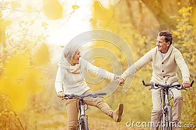 Active seniors riding bike Stock Photo