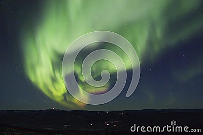 Active splitting aurora borealis arc Stock Photo