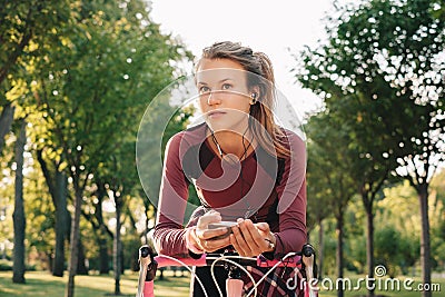 Active sport woman with bicycle Stock Photo