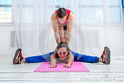 Active sportive woman stretching her legs and back Stock Photo