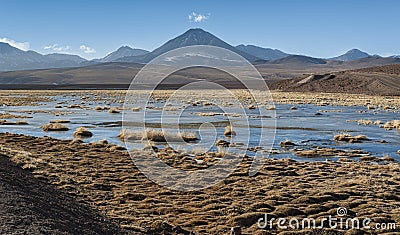 Active volcano Putana also known as Jorqencal or Machuca near Vado Rio Putana in Atacama Desert, Chile Stock Photo