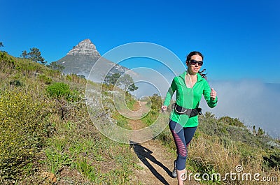 Active woman runner runs trail Stock Photo