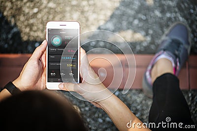 Active woman using a digital device Editorial Stock Photo