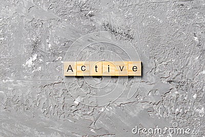 Active word written on wood block. active text on table, concept Stock Photo