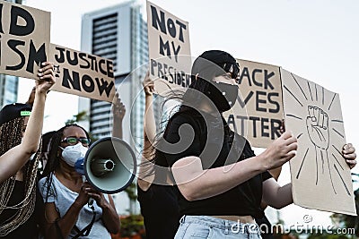 Activist movement protesting against racism and fighting for equality - Demonstrators from different cultures and race protest Editorial Stock Photo