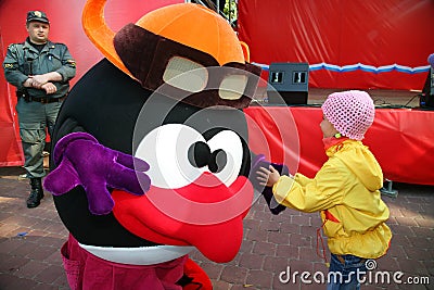 Actor animator city Park in costume doll cartoon hero funny Smeshariki entertains children and adults in celebration of the day. Editorial Stock Photo
