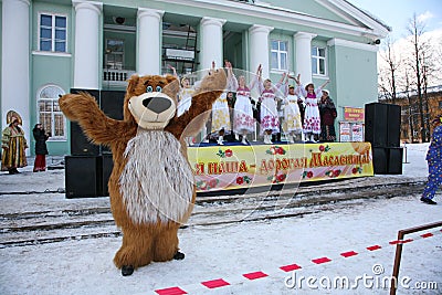 Actor animator of the house of culture of the city metallostroy in the costume of the jolly bear entertains children and adults Editorial Stock Photo