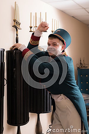 Actor dressed historical costume in interior of old theater. Stock Photo