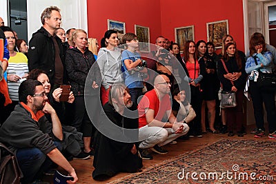 Actor in historical costume of monk among spectators Editorial Stock Photo