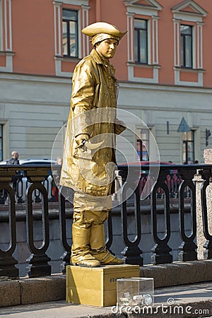 Actor-mime in the image of a living statue on the embankment of the Griboedov Canal. Saint-Petersburg Editorial Stock Photo