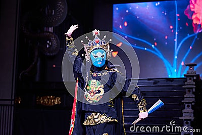 Actor performing Sichuan opera face changing Editorial Stock Photo