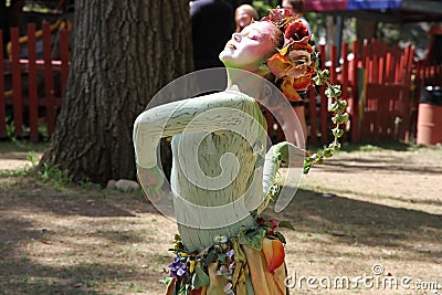 An actress dressed as a green fairy performs a dance at the annual Bristol Renaissance Faire Editorial Stock Photo