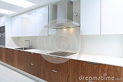 Actual modern kitchen in white and walnut wood Stock Photo