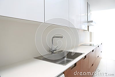 Actual modern kitchen in white and walnut wood Stock Photo