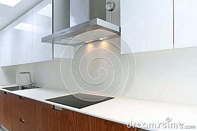 Actual modern kitchen in white and walnut wood Stock Photo