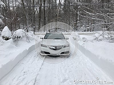 Acura TLX AWD in the snow in winter with lights on Editorial Stock Photo