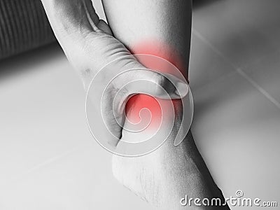 Acute pain with ankle pain Compression of the tendons Stock Photo