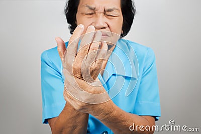 Acute pain in a senior woman wrist Stock Photo